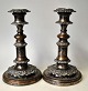 A pair of 
antique English 
telescopic 
candlesticks, 
19th century 
silver-plated 
copper. 
Decorated ...