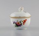 Fürstenberg, Germany. Antique lidded bowl in hand-painted porcelain with flowers 
and gold decoration. Early 20th century.
