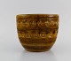 Aldo Londi for Bitossi. Flower pot in mustard yellow glazed ceramics with 
geometric patterns. 1960s.
