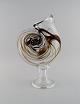 Michael Bang 
for Holmegaard. 
Large rare vase 
in mouth blown 
art glass 
shaped like 
snail shell. 
...