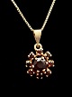 14 carat gold chain 43 cm. with pendant 1.3 cm. with numerous garvets from jeweler B.Hertz ...