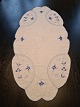 Table runs 
embroidered 
with blue 
fluted pattern 
Measures 46 x 
91 cm. 
Appears with 
...