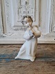 Lladro figure 
in the form of 
angel child 
playing flute
Height 16 cm.