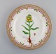 Royal Copenhagen Flora Danica dinner plate in hand-painted porcelain with 
flowers and gold decoration. Model number 20/3549.
