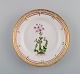 Royal Copenhagen Flora Danica salad plate in hand-painted porcelain with flowers 
and gold decoration. Model number 20/3573.
