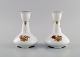 Two Royal Copenhagen Golden Basket candlesticks in porcelain with flowers and gold decoration. ...