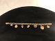 Elegant Bismark Bracelet 14 carat Gold with 7 charms in 14k gold.form of mussel with pearl, i ...