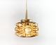 Glass ceiling lamp with brass elements and honey-colored glass made in Denmark in the 1960s. ...