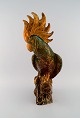 Sevres, France. Large and rare figure in glazed ceramics. Kakadu. Beautiful golden running glaze ...