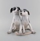Large and rare Royal Copenhagen porcelain figure. Puppies with bone. Model number 750. Early ...