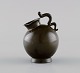 Just Andersen (1884-1943), Denmark. Early miniature vase in disko metal. Hank shaped like a ...