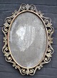 Mirror, 19th century. Bronze and bronzed iron frame. Oval. H .: 62 cm. W .: 45 cm.NB: Mirror ...