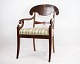 Lateempire armchair in mahogany with light striped fabric from around the year 1840. Stands in ...
