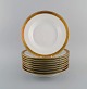 Royal Copenhagen service no. 607, White. 9 deep plates in porcelain with gold 
edge. Model number 607/9587.
