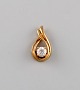 Scandinavian jeweler. Pendant in 14 carat gold adorned with semi-precious stone.
