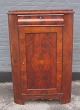 Late-empire 
 corner cabinet 
in mahogany, 
ca.1860, 
Denmark. With 
drawer at the 
top and door 
with ...