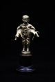 Old bronze 
figure of the 
pig boy holding 
2 small pigs 
under the arm. 
The figure 
stands on a ...