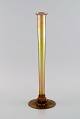 Antique Tiffany Favrile vase in iridescent mouth-blown art glass with bronze 
foot. Early 20th century.

