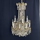Height 90 cm.Diameter 60 cm.Beautiful prism chandelier with gilded frame from the early ...