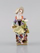 Augustus Rex, 
Germany. 
Antique 
hand-painted 
porcelain 
figure. Girl 
with flowers 
and fruit. 19th 
...