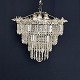 Diameter 50 cm.Height 40 cm.Fine paflon chandelier from the 1920s with 3 rings hung with ...