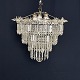 Diameter 50 cm.
Height 40 cm.
Fine paflon 
chandelier from 
the 1920s with 
3 rings hung 
with ...