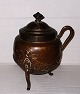 Copper jar with lid and handle standing on three legs. In good condition without damage or ...