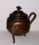 Copper jar with 
lid and handle 
standing on 
three legs. In 
good condition 
without damage 
or ...