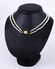 Necklace with a pearl necklace of cultured pearls double trotted in a course with a nice gilded ...