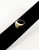 14 carat handmade gold ring stamped H.Mann 585. Thick smooth ring rail with a perforated ...