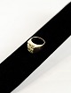 14 carat 
handmade gold 
ring stamped 
H.Mann 585. 
Thick smooth 
ring rail with 
a perforated 
...