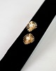 Vintage 14 
carat ear clips 
stamped 585, 
bra designed by 
Bernhard Hertz 
- Copenhagen. 
The ear ...