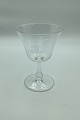 Wine glass with monogram on bell-shaped basin and hollow stem