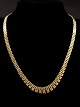 14 carat gold 
brick necklace 
L.41.5 cm. 
W.5.5-0.95 cm. 
from jeweler 
Johs Kahn 
Copenhagen. 
item ...