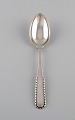Early Georg Jensen Rope dessert spoon in silver (830). Dated 1915-1930. Three 
pieces in stock.
