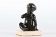 Just Andersen 
Figure D 2326 
made of disco 
metal with 
patina 
of a naked boy 
sitting on a 
...