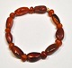 Amber bracelet with 18 polished pieces, Denmark. Fitted with elastic. Length 18 cm.