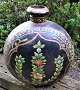 Large Persian floor vase in hammered iron with paintings, 19th century. Black base color with ...