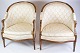 A set of two 
louise seize 
chairs in 
polished 
mahogany with 
brightly 
decorated 
fabric from the 
...