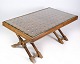 Dark wood coffee table with glass top from around the 1960s.Dimensions in cm: H: 46 W: 107 D: 62
