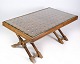 Dark wood 
coffee table 
with glass top 
from around the 
1960s.
Dimensions in 
cm: H: 46 W: 
107 D: 62
