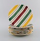 Longchamp, France. 10 plates in glazed faience with hand-painted striped 
decoration. Mid-20th century.
