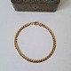 Armor bracelet 
in 8 kt gold 
Stamped: 333 - 
JAa
Length 20 cm. 
Width 4,2 mm.