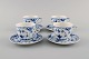 Four Royal Copenhagen Blue Fluted Half Lace coffee cups with saucers. Model 
number 1/528.
