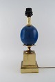 Le Dauphin, France. Table lamp with blue orb and brass base with leaves. 1960 / 70s.Measures: ...