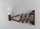 Erik Hansen, Denmark. Scissor lamp in dark oak. 1960/70's.Height: 25 cm.Length: 30-67 ...