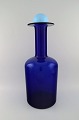 Otto Brauer for Holmegaard. Large vase / bottle in blue art glass with light 
blue ball. 1960