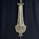 Height 93 cm.Diameter 29 cm.Elegant prism chandelier from the 1910-1920s.It has three ...