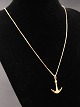 14 carat gold 
chain 45 cm. 
with Ole 
Lynggaard 
Vintage pendant 
of 14 carat 
gold made as an 
...