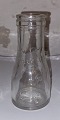 Small cream bottle in clear glass
